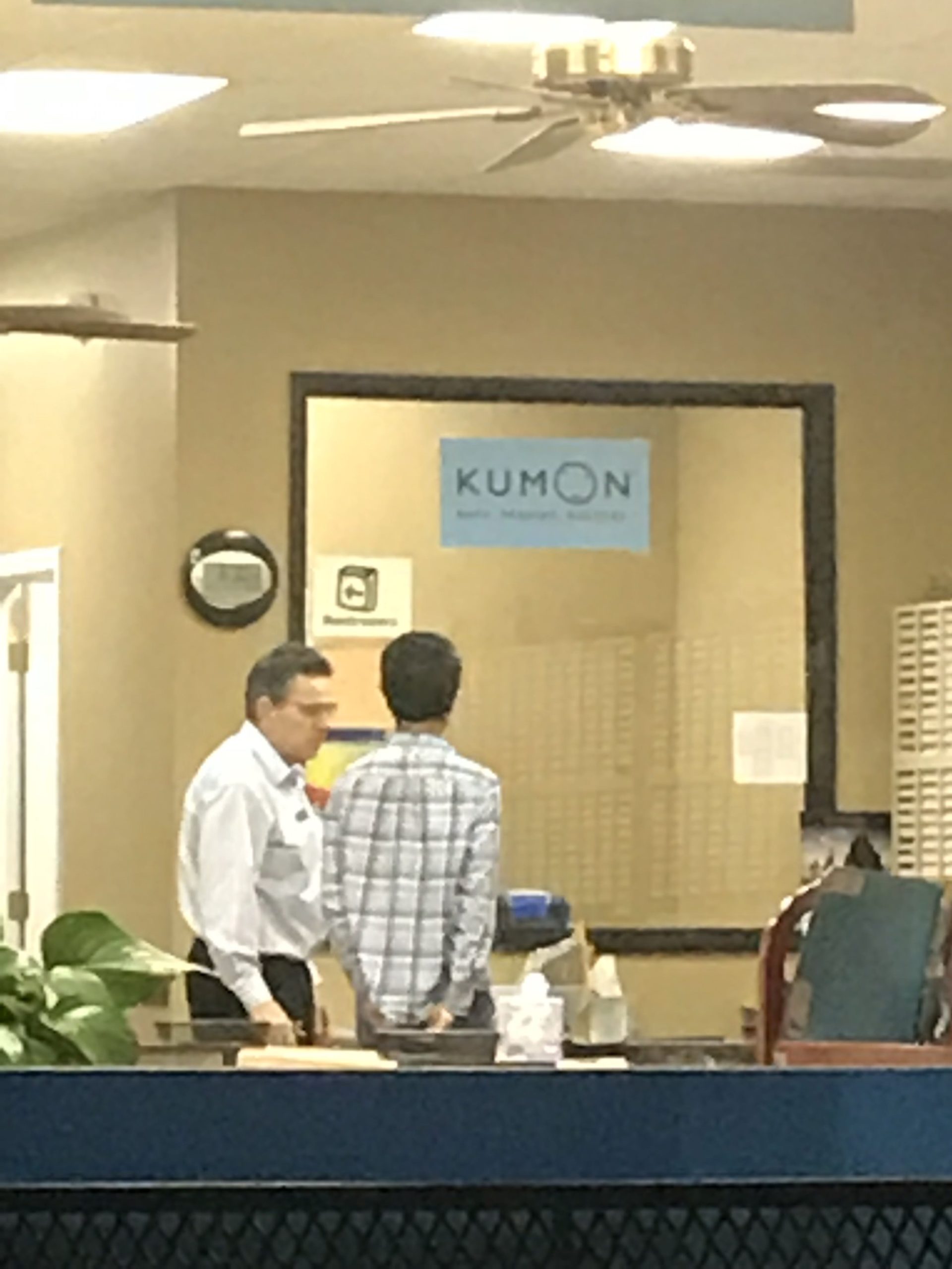 AT KUMON GETTING SOME TIPS FROM MY SUPERVISOR